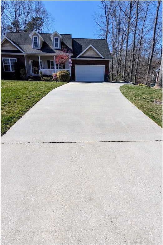 After power washing: bright, evenly cleaned driveway